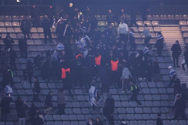 Stadium security intervene next to supporters holding Israeli flags during the UEFA Nations League League A, Group A2 football match between France and Israel at The Stade de France stadium in Saint-Denis, in the northern outskirts of Paris, on November 14, 2024. — AFP pic