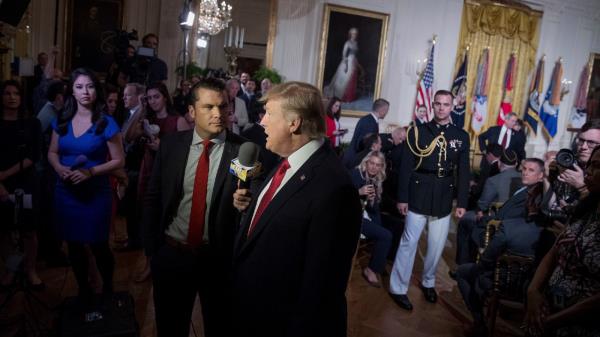 FILE - President Do<em></em>nald Trump appears on Fox & Friends co-host Pete Hegseth at a Wounded Warrior Project Soldier Ride event in the East Room of the White House in Washington, Thursday, April 6, 2017.