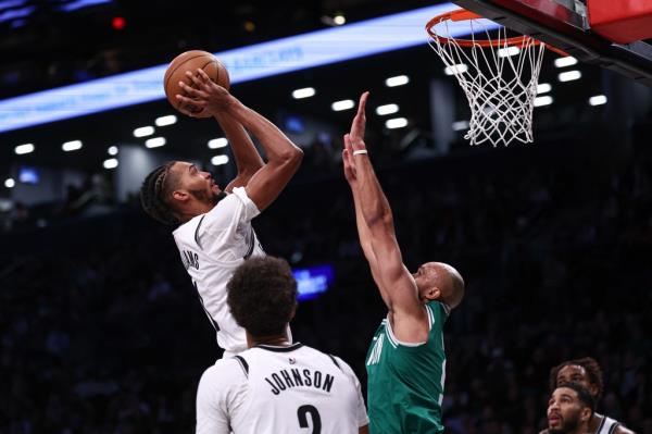 Ziaire Williams shoots over Derrick White during the Nets' loss to the Celtics.