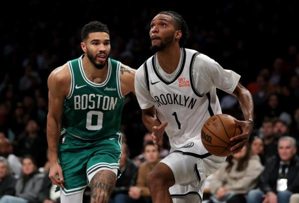 Ziaire Williams drives past Jayson Tatum during the Nets' loss to the Celtics.