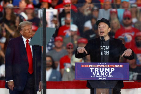 Elon Musk on stage with President-elect Do<em></em>nald Trump during Trump's campaign in Butler, Pa. on Oct. 5.