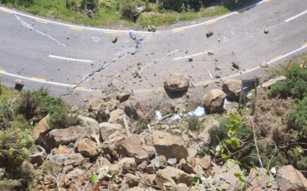 Tuesday after the first day of scaling/rock removal at the Epitaph rift, showing why people cannot be on the road while work is underway given the distance the rocks travel, bouncing over the highway into the bush.