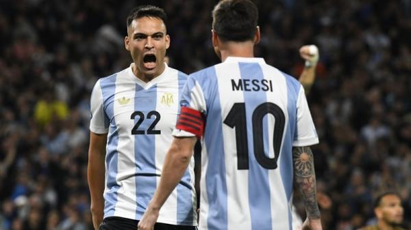 Lautaro Martinez celebrates with Lio<em></em>nel Messi as Argentina beat Peru