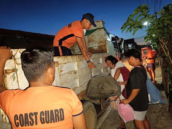 This handout photo taken on November 15, 2024 and released by the Philippine Coast Guard (PCG) on November 16 shows coast guard perso<em></em>nnel evacuating residents during an operation in Virac town, Catanduanes province, ahead of the arrival of Typhoon Many-yi. Philippine authorities ordered all vessels back to shore and people in coastal communities to leave their homes on November 16 as Typhoon Man-yi neared the storm-weary archipelago nation, with forecasters expecting it to intensify before making landfall. — Philippine Coast Guard handout pic via AFP