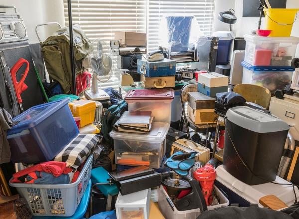 Piles of junk and clutter in a room in a house