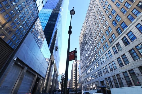 View from the street on West 31st Street showing close proximity of Two Manhattan West and FIT's Kaufman Hall, which face each other on opposite sides of the road.