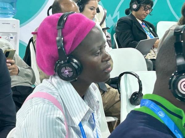 A member of the audience during one of the sessions hosted by ECW. The sessions highlighted the need to ensure there is funding for education for those on the fro<em></em>ntlines of the climate crisis, armed co<em></em>nflict and other emergencies. Credit: ECW