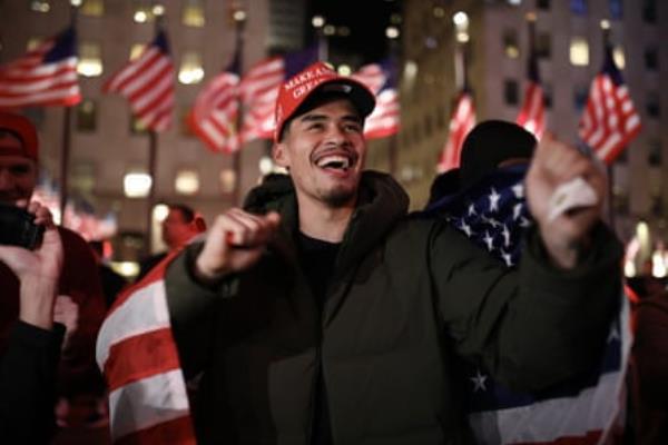 man smiles and cheers 