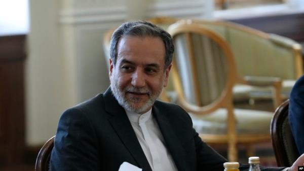 FILE - Iranian Foreign Minister Abbas Araghchi attends a meeting with Qatari Prime Minister and Foreign Minister Sheikh Mohammed bin Abdulrahman Al Thani, in Tehran, Iran, Aug. 26, 2024.