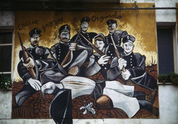 A beautiful wall painting in Orgosolo evoking the massacre of Murguliai from 1899, is an example of the rich history the island of Sardinia is offering Americans.