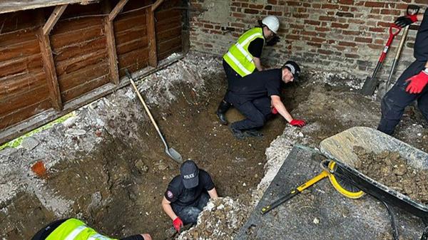 Police officers searching inside a barn at a Hertfordshire farm for the remains of Muriel McKay.
Pic: Met Police/PA