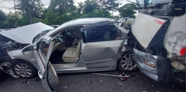 Three individuals, including a woman, suffered minor injuries after a five-to<em></em>nne lorry rammed 11 cars and a motorcycle along the Middle Ring Road 2 yesterday. — Picture courtesy of the Fire and Rescue Department 