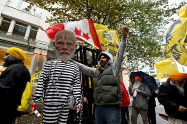 A Sikh protester holds up an effigy of the Indian prime minister outside the Indian co<em></em>nsulate in Vancouver, British Columbia, on 18 October.